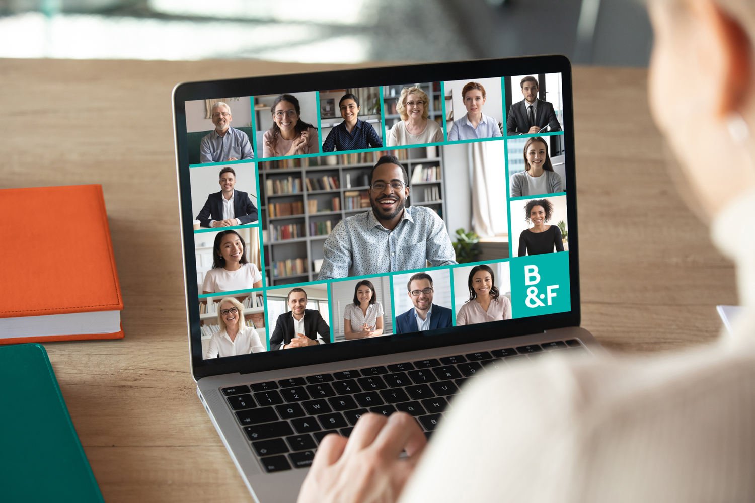 Back view of female employee speak talk on video call