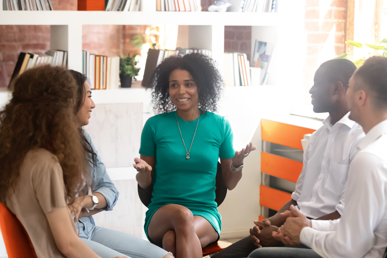 A people manager speaking to her team