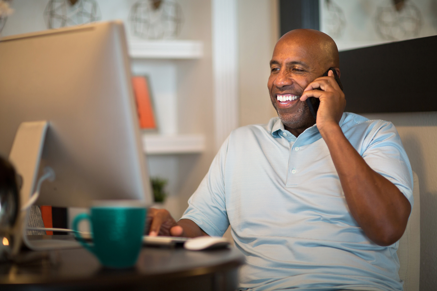 African American man working from his home office.