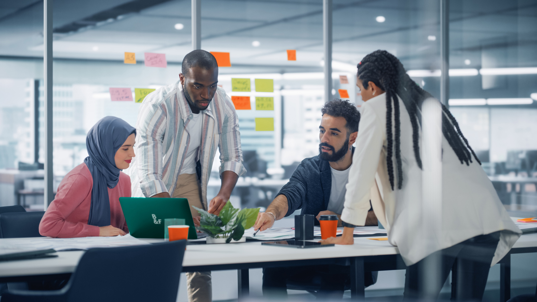 Office Conference Room Meeting: Diverse Team of Young Investors, Workers, Developers work on Creative e-Commerce Digital Startup. Group of Multi-Ethnic Business Professionals work on Product Strategy