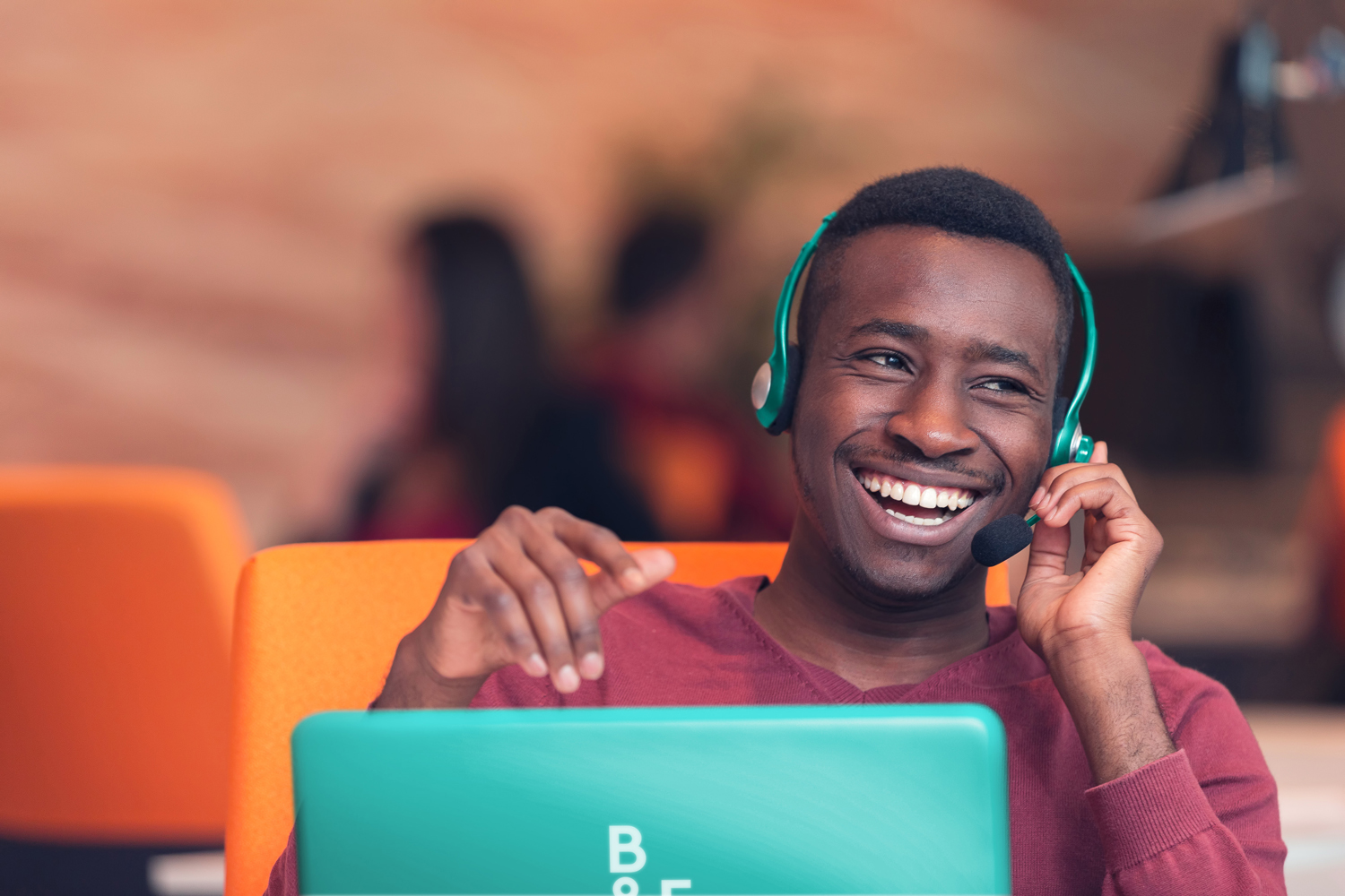 A happy guy listening to an online workshop