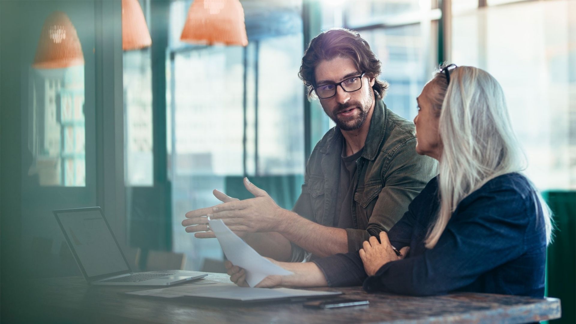 Work colleagues discussing a project.